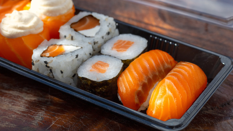 Assorted takeout salmon sushi in to-go container