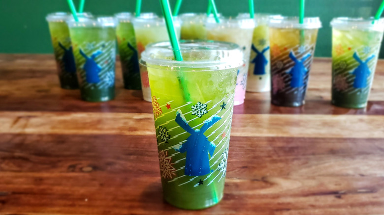 Mango matcha lemonade from Dutch Bros on wooden table.