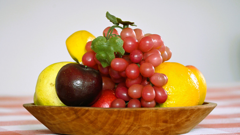 Artificial fruit bowl placed on a table