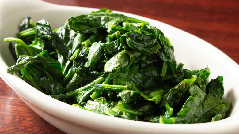 Wilted spinach in white bowl