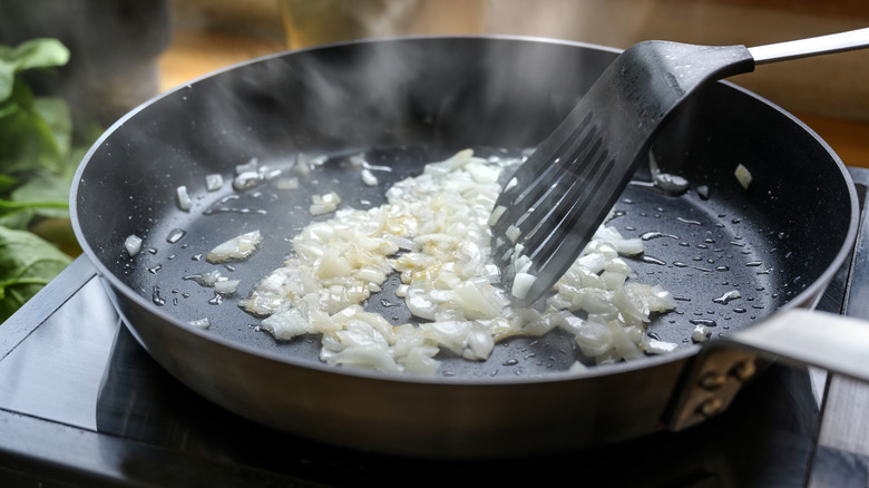 Sautéing diced onion in frying pan