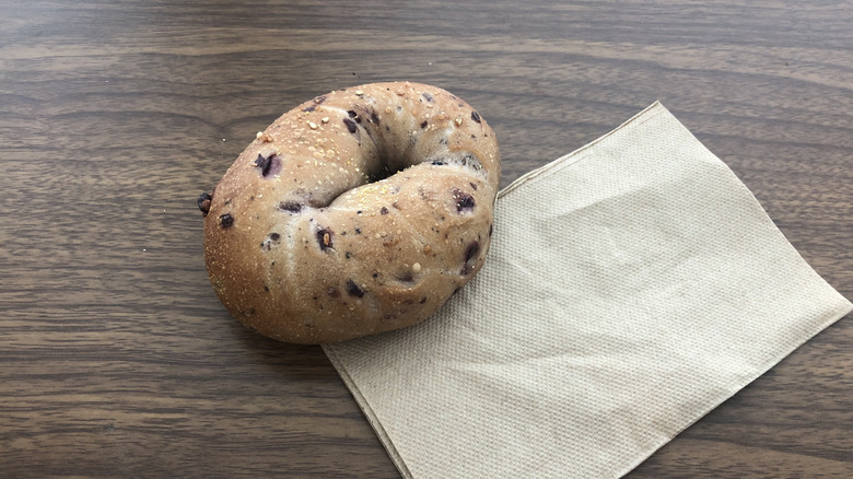 Einstein Bros blueberry bagel on a napkin.