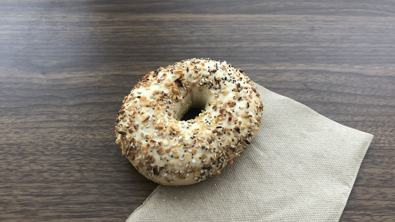 Einstein Bros everything bagel on a napkin.