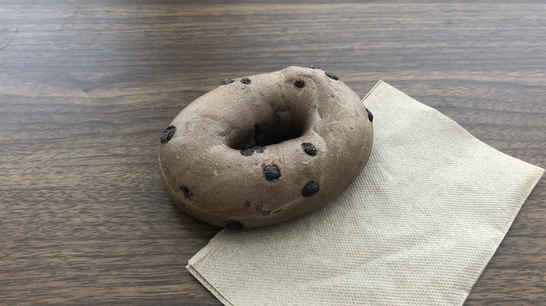 Einstein Bros chocolate chip bagel on a napkin.
