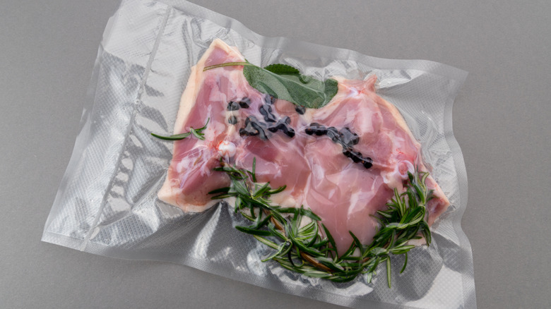 Chicken thighs with rosemary in a sous vide bag