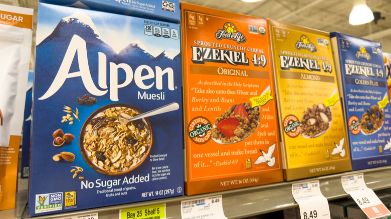 Boxes of muesli and Ezekiel brand cereal on top shelf