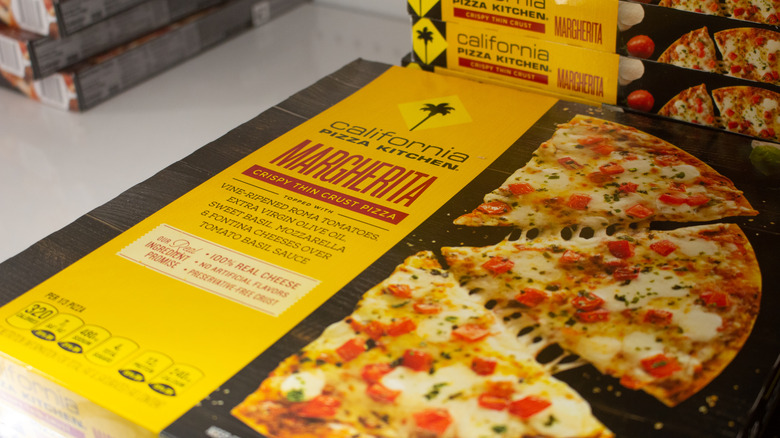 stacks of frozen California Pizza Kitchen pizzas