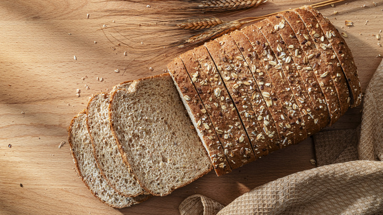 Top down view of sliced loaf of seeded bread