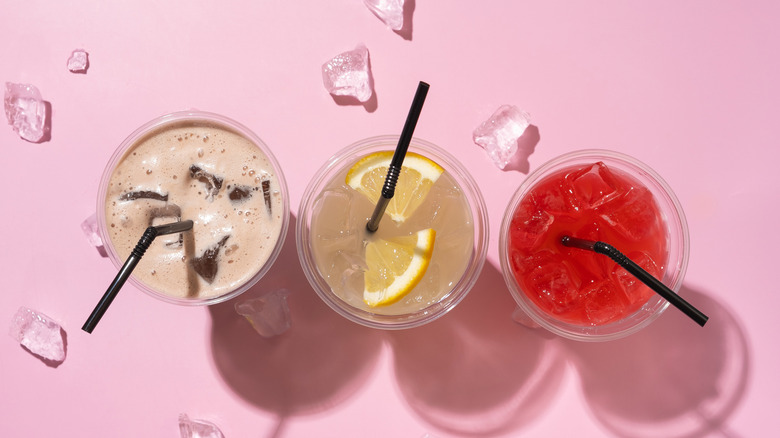 three different cups of iced beverages
