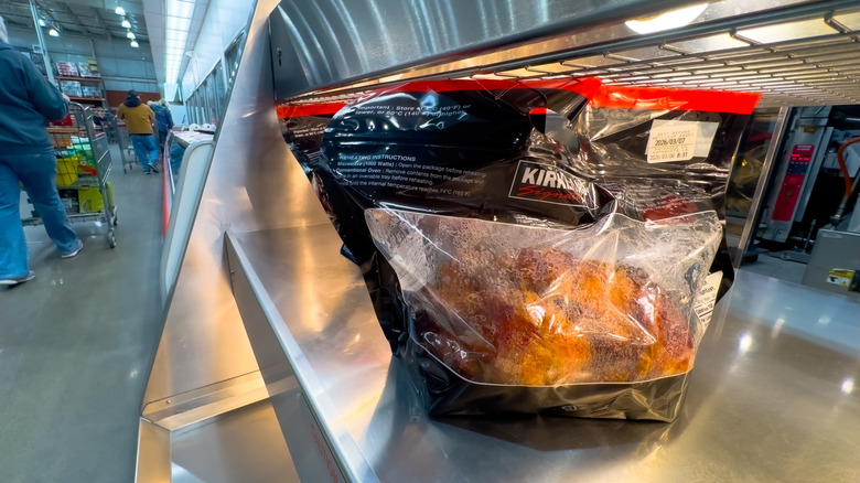 Costco rotisserie chicken sitting under heat lamp