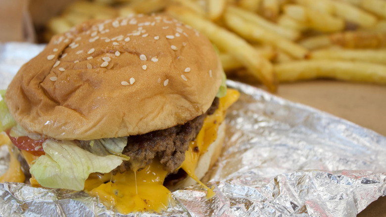 close up of burger on silver foil from Five Guys