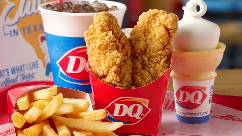 Dairy Queen chicken strips with fries, drink, and soft serve cone.