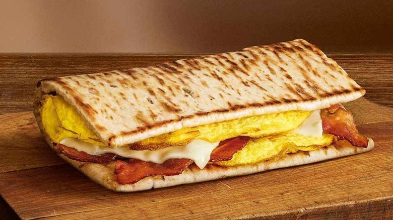 Subway breakfast flatbread on wooden table