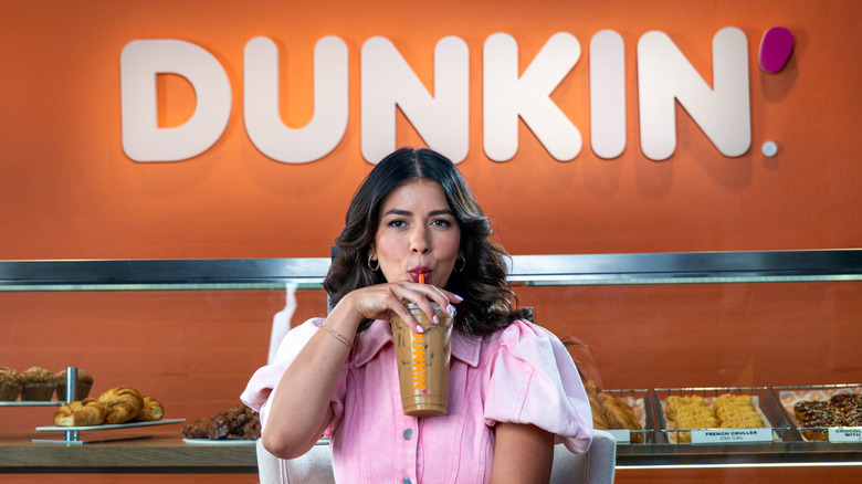 Jen Affleck sipping on drink from Dunkin' Donuts.