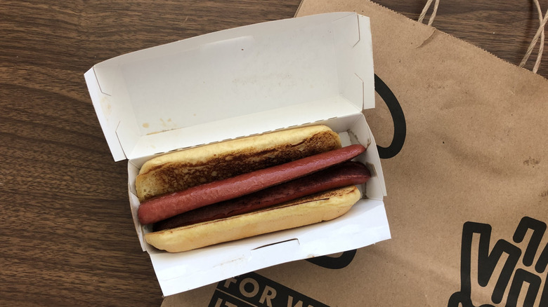 Shake Shack plain hot dog in paper box and to-go bag.