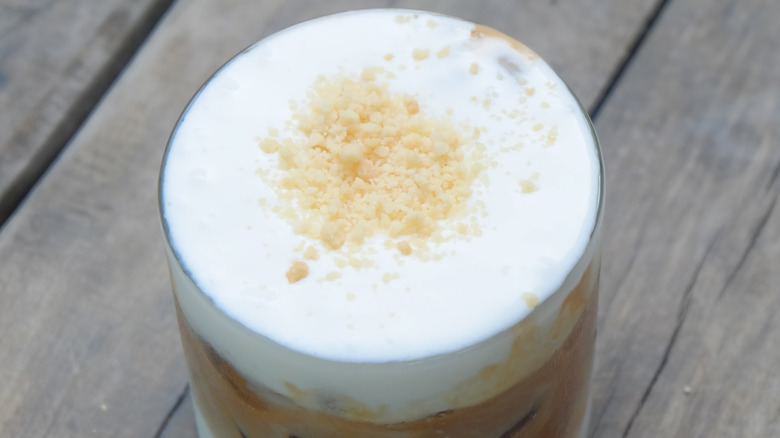 Frothy latte with cookie crumbles