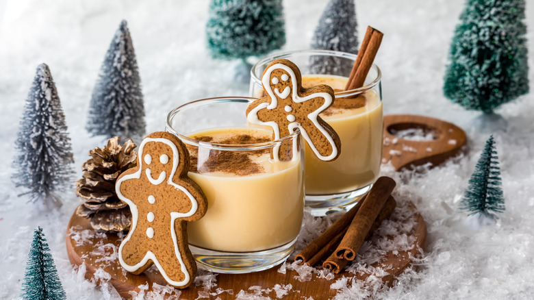 Glasses of refreshing egg nog with cinnamon sprinkled on top.