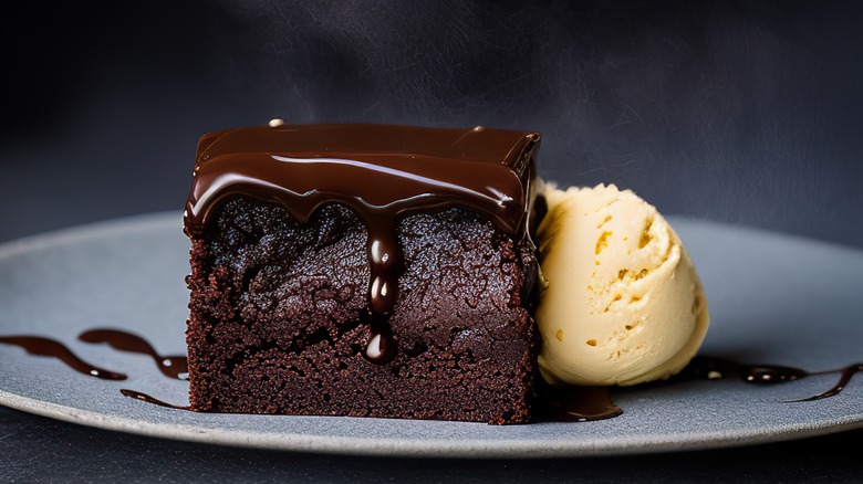 Decedent chocolate brownie with ice cream drizzled with chocolate balsamic vinegar