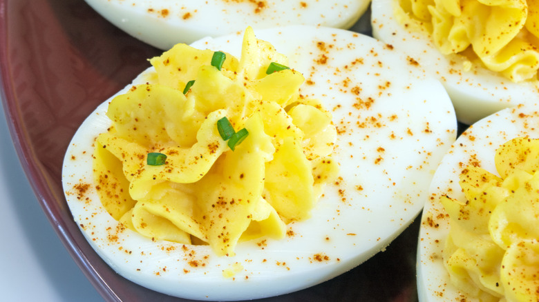 Close up of devilled eggs on brown plate