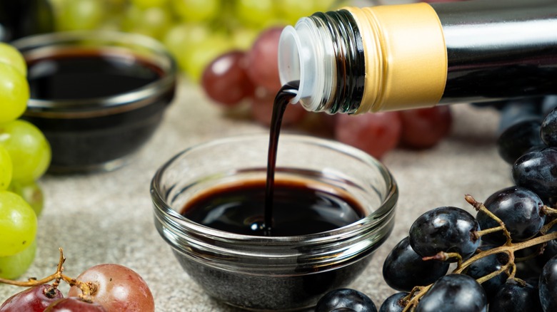Balsamic vinegar being poured into a bowl