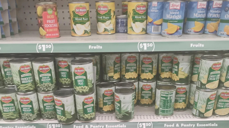 Canned fruit and vegetables on shelf at Dollar Tree