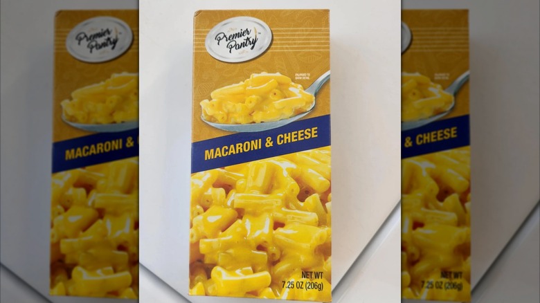 Mirrored image of Premier Pantry box of mac and cheese on white table