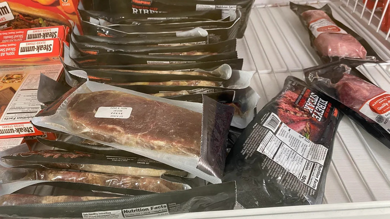Pile of Dollar Tree steaks in the freezer section