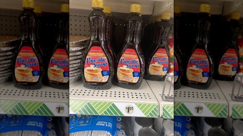 mirrored image of butter-flavored pancake syrup on store shelf