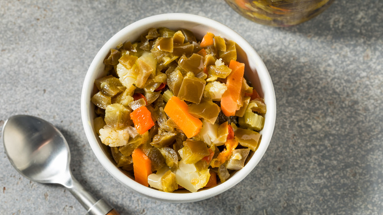 Chicago-style giardiniera in white bowl with silver spoon