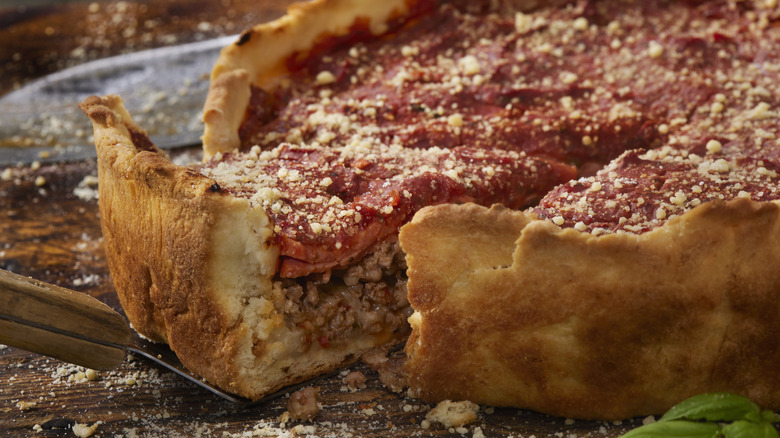 Serving a slice of Chicago deep dish pizza