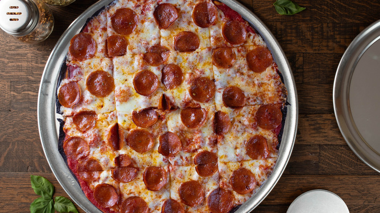 Chicago tavern-style pizza on wooden table