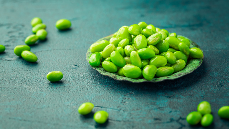 Small plate of raw edamame beans