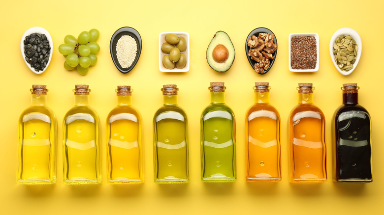 Row of unsaturated fat oils, including olive oil, avocado oil, and walnut oil