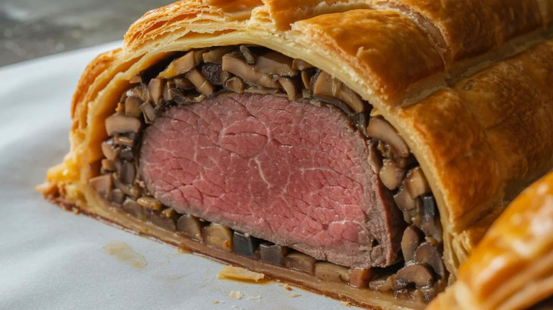 Close-up of a sliced beef Wellington.