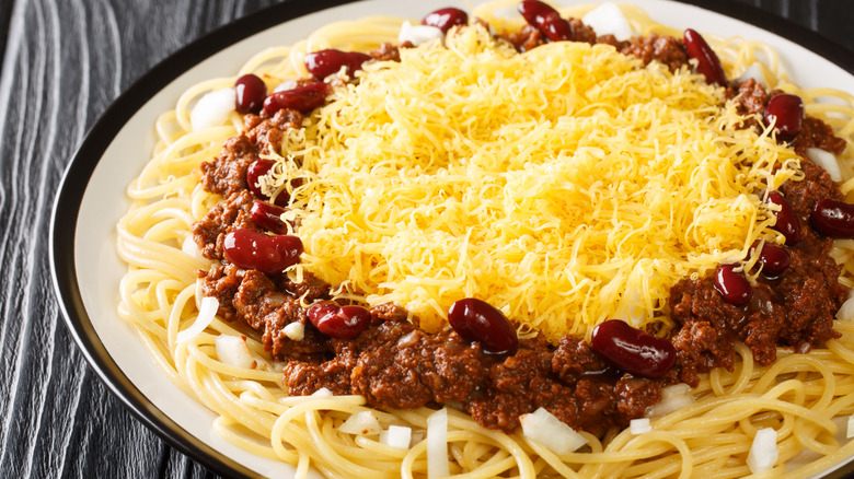 Cincinnati chili over noodles on a plate