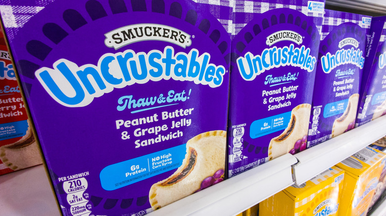 freezer shelves filled with Smucker's brand Uncrustables frozen sandwiches