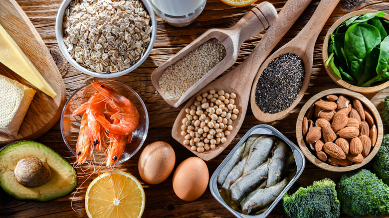 An array of nutrient-dense whole foods, seeds, nuts, fish, eggs, vegetables