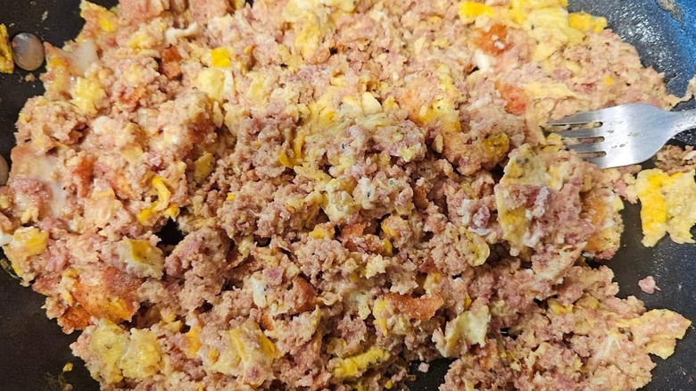 Pork brains and scrambled eggs in a skillet