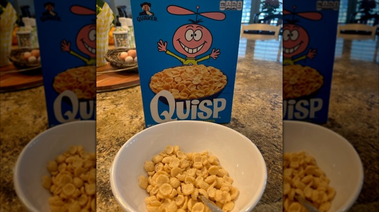 Bowl of Quisp cereal next to cereal box