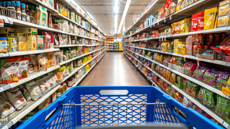 Shopping cart going down aisles at Walmart