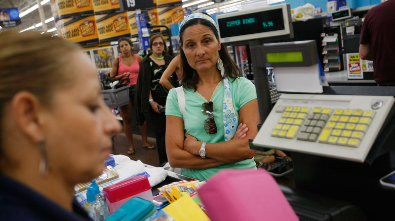 Tired shoppers checking out at Walmart