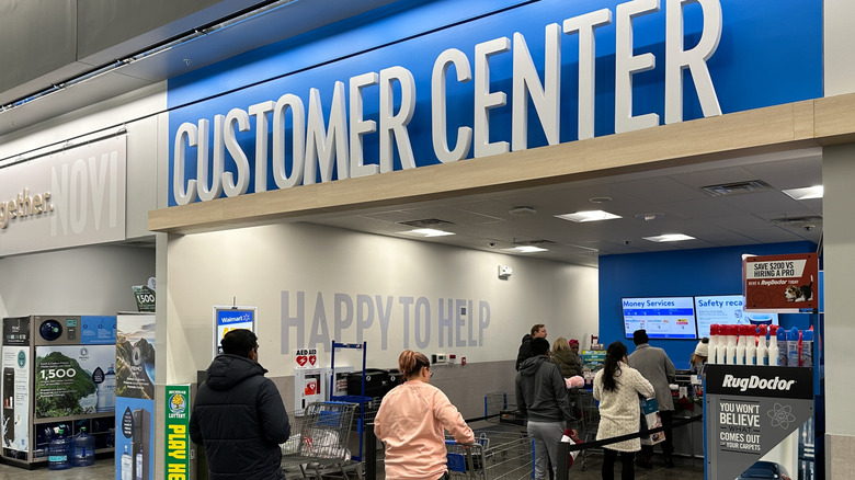 Customers waiting in line at Walmart customer service area