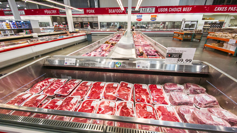 Costco meat section with steaks in the foreground