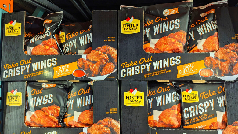 bags of chicken wings at a grocery store