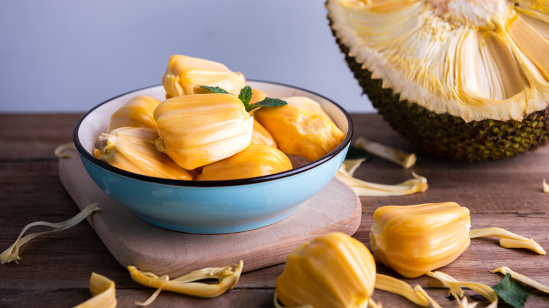 Jackfruit in a bowl with half the fruit sitting behind it