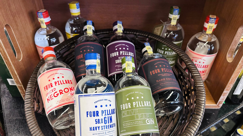 A basket with an assortment of Four Pillars gins with a crate in the background.