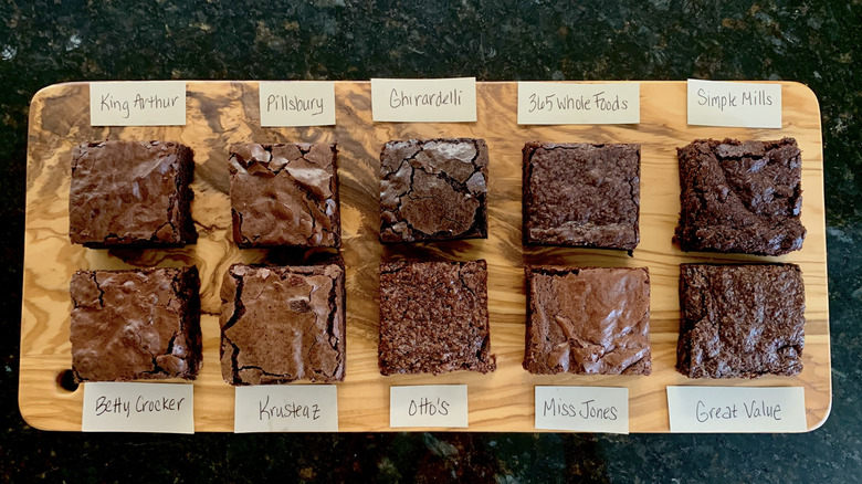 overhead shot of baked brownie squares on a wooden board