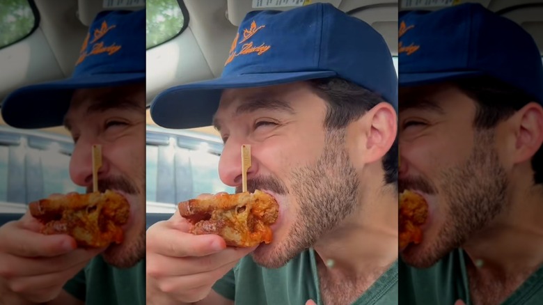 taking a bite of gluten-free sandwich