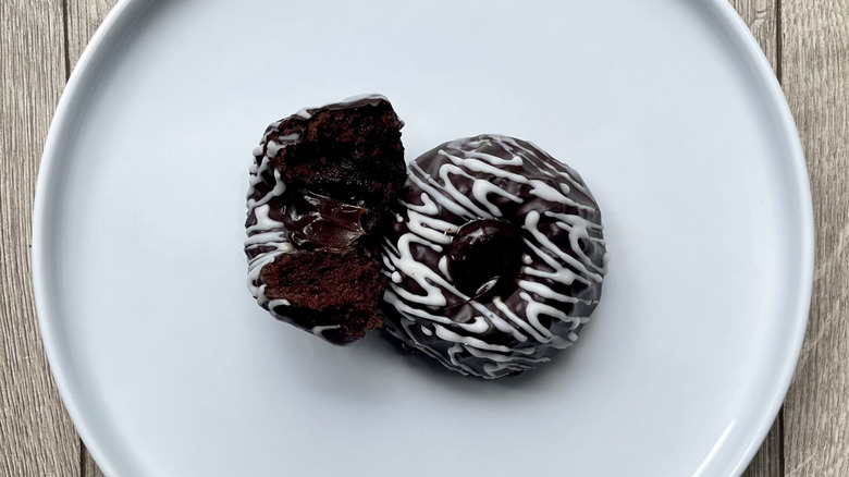 Whole and sliced chocolate Bundt cake on a plate