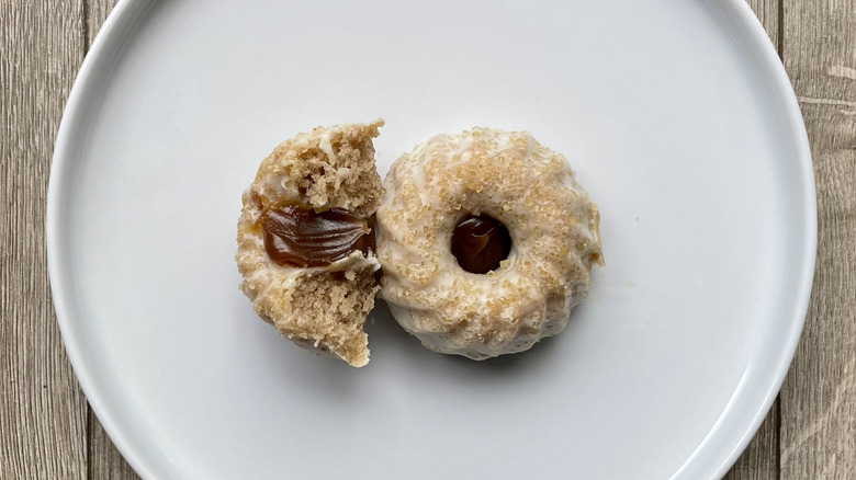 Whole and sliced churro Bundt cakes on a plate